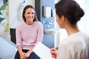 patient with a doctor at a cervical cancer screening