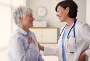patient and a doctor smiling together