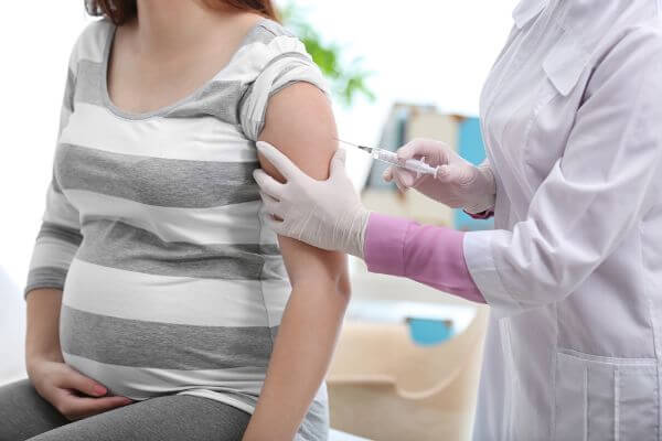pregnant person receiving a vaccine