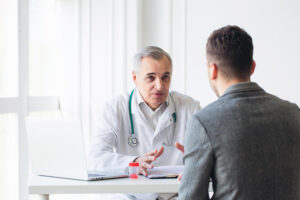 patient consulting his doctor over medication